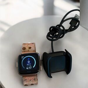 Fitbit Versa Smartwatch with Charger and Floral Patterned Strap